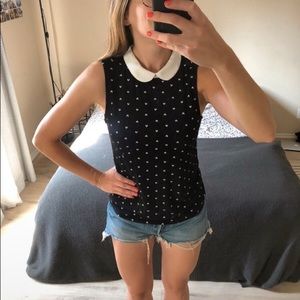 Black sleeveless top with Peter Pan collar
